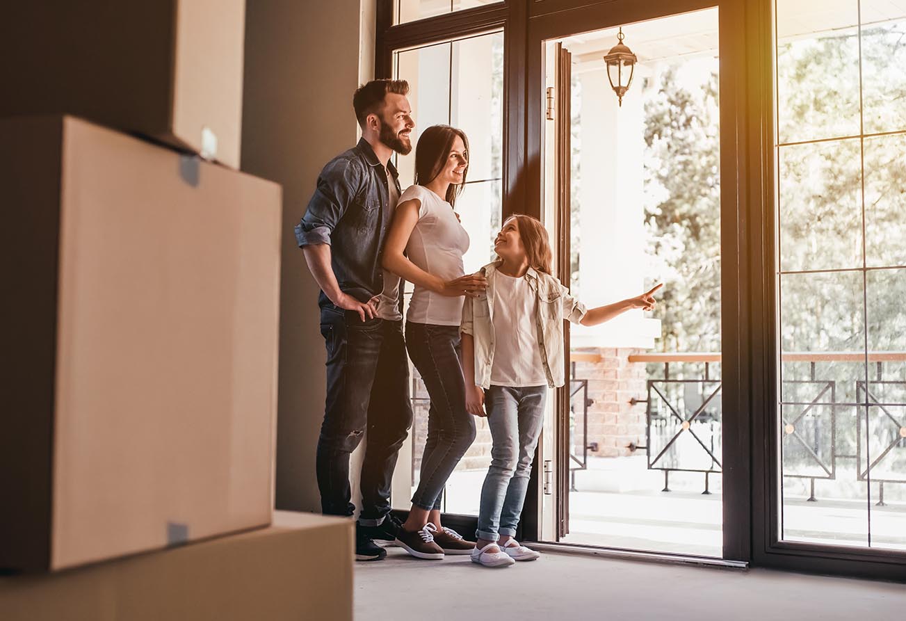 Happy family moving into their new house after a home inspection 