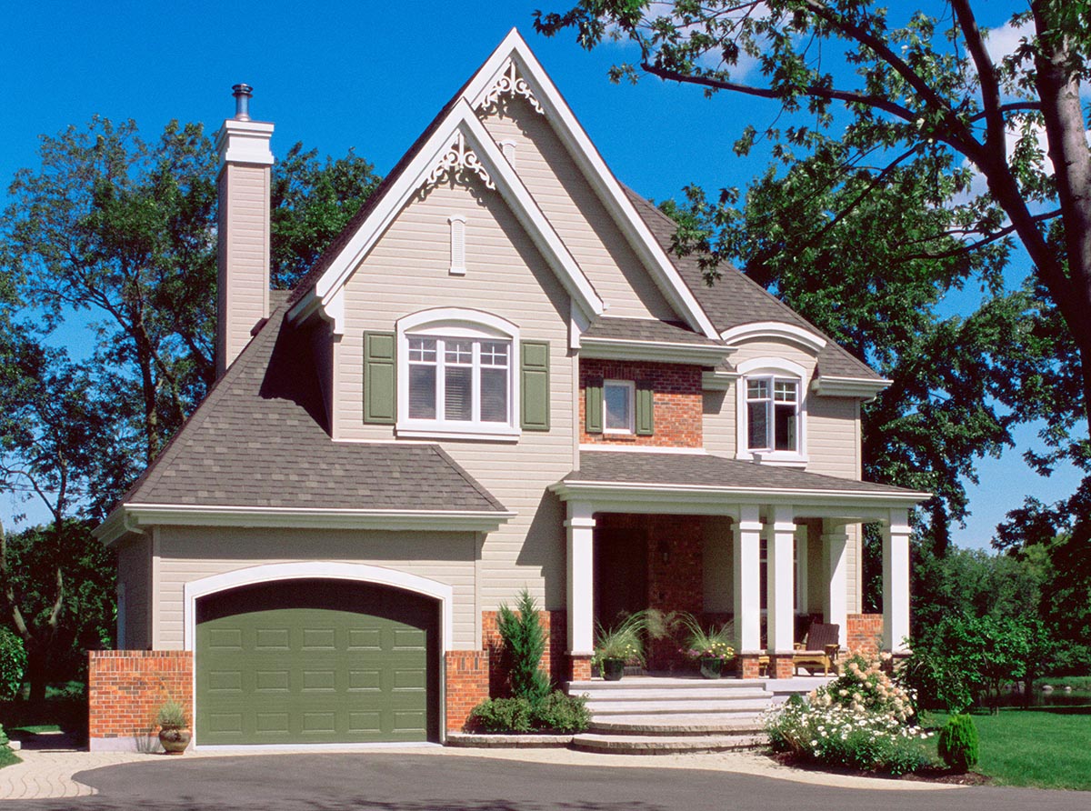 Luxury suburban house with well groomed garden seen while performing home inspection services 