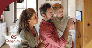 Happy family adjusting a smart thermostat in their energy-efficient home, ensuring year-round comfort