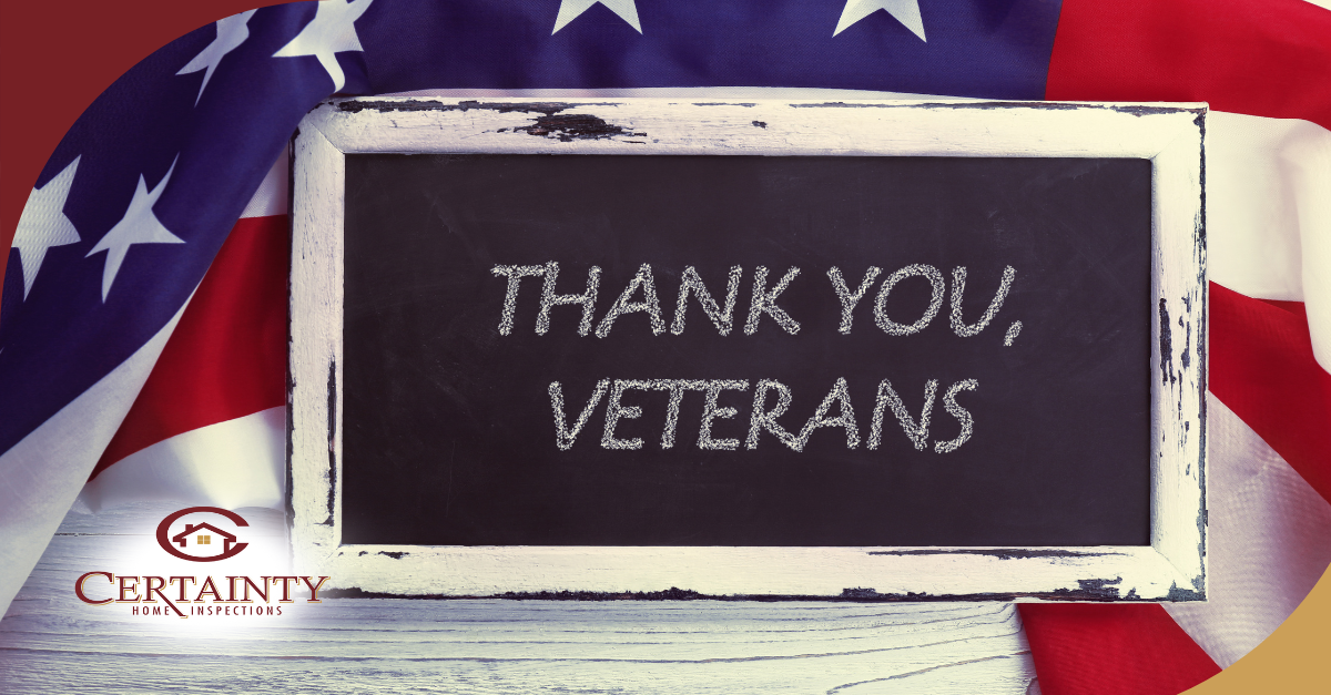 Chalkboard with 'Thank You, Veterans' message, surrounded by an American flag