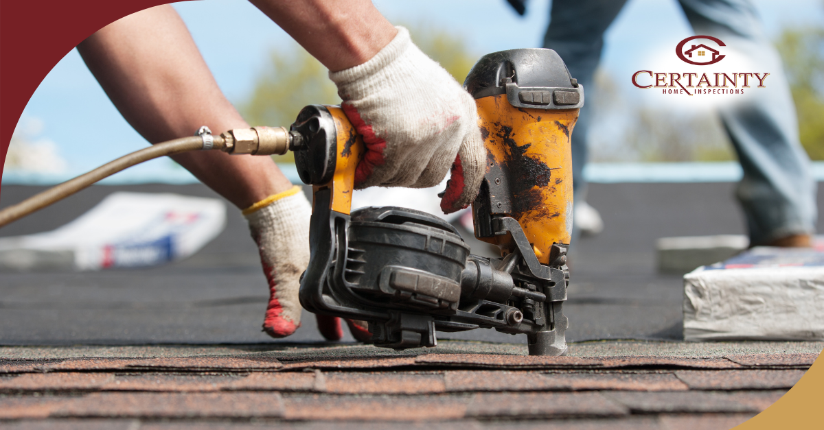 Roof inspection with a roofing nail gun being used to secure shingles.